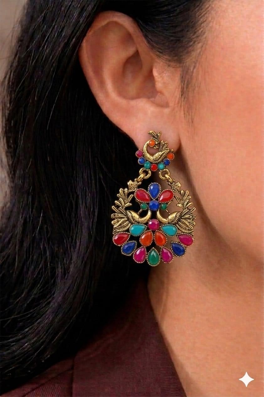 Ornate peacock-inspired earring